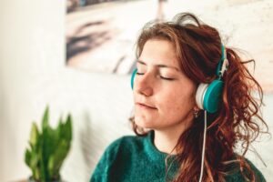 Woman listening to a Spiritual Hypnotherapy session
